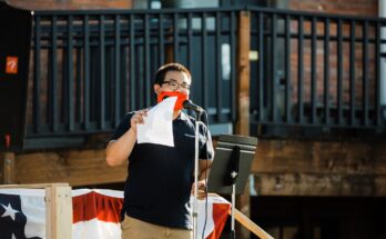 Campaign manager Adam Marl speaks at the Kickoff Rally for the Recall in July 2020. Photo by Lady and Gent. Courtesy Recall Dan Holladay.