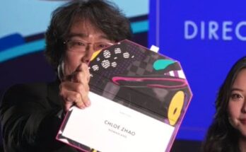 Photo: Bong Joon-ho holds Chloe Zhao’s “Best Director” card at the 2021 Academy Awards.